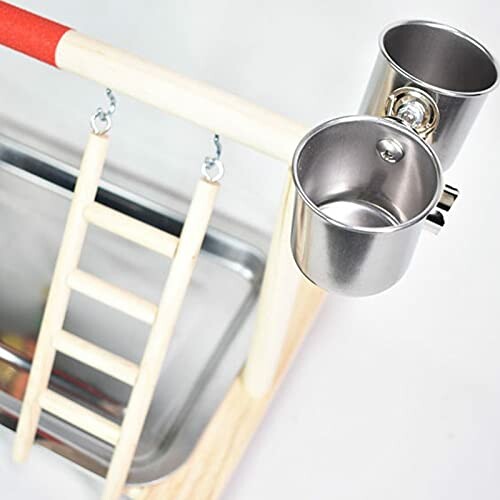 Bird play gym with a ladder and stainless steel cups.