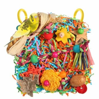 Colorful bird toy with parakeet perched on top.