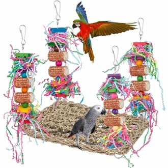 Parrots on colorful bird toys hanging from a woven mat.